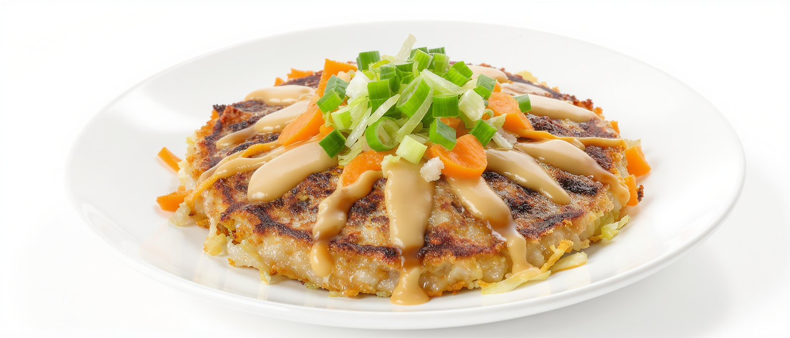 découvrez l'okonomiyaki, la célèbre crêpe japonaise d'osaka, une spécialité gourmande et savoureuse à base de chou, de pâte et d'ingrédients variés. apprenez-en plus sur cette recette emblématique et ses secrets de préparation.